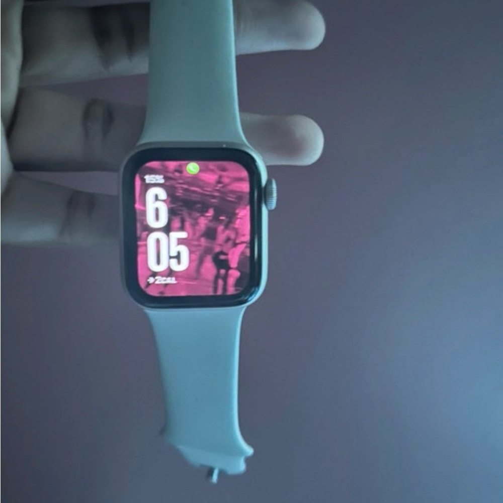 Apple Smartwatch with Silver Band and Pink Screen
